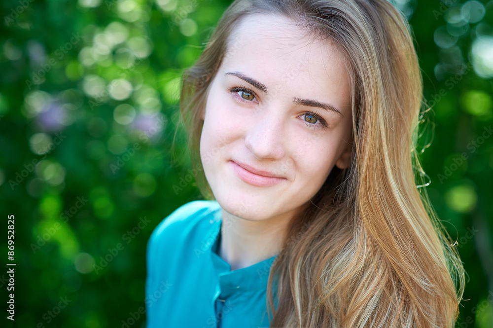 Fototapeta premium beautiful spring young woman in a park