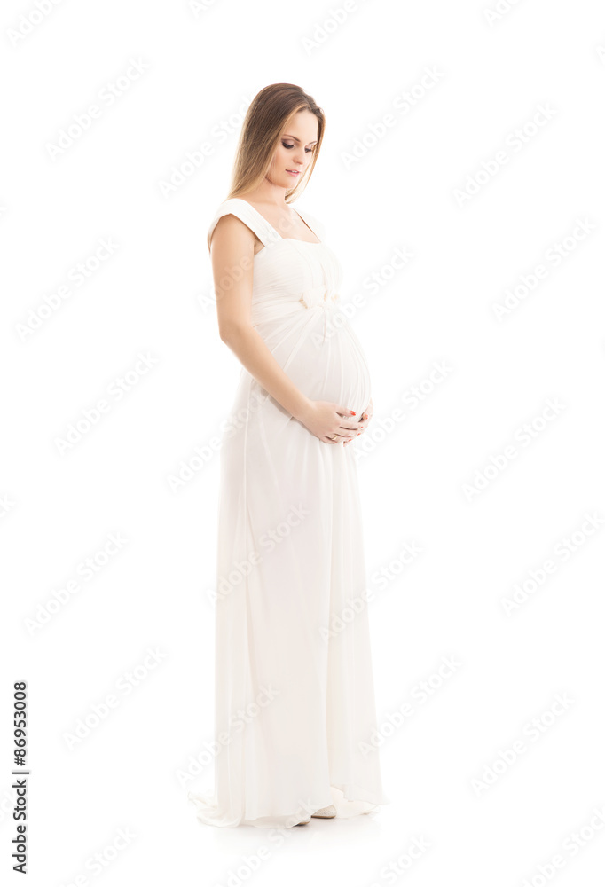 Young and beautiful pregnant woman in antique dress over grey background with a lot of blank space