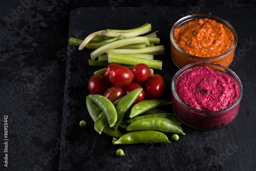 Fresh organic vegetables and vibrant dip selection