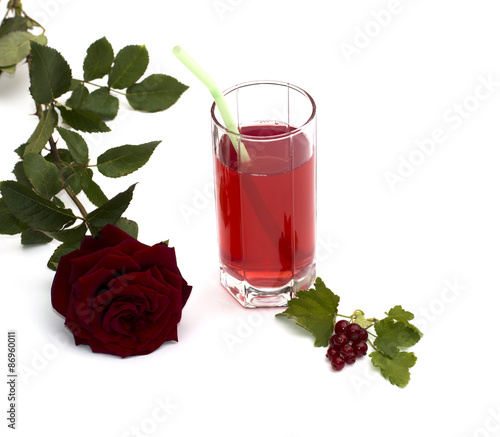 glass of juice of currant and red rose