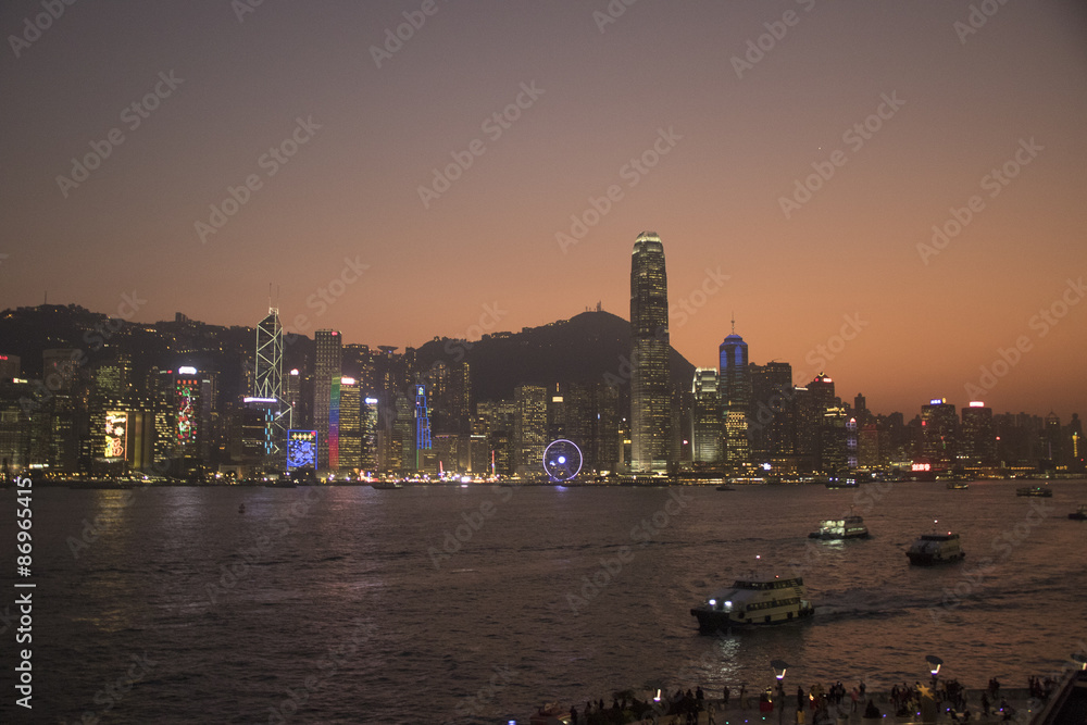 Fototapeta premium Skyline of Hong Kong Island and Hong Kong Harbor at sunset.Hong Kong