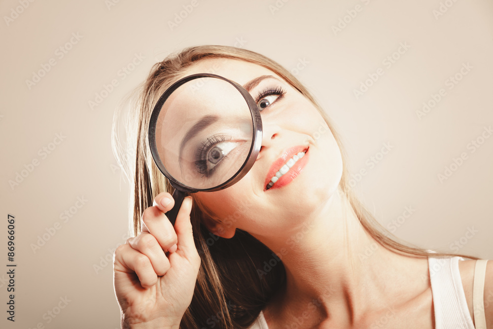 girl holding on eye magnifying glass loupe girl holding on eye magnifying glass loupe