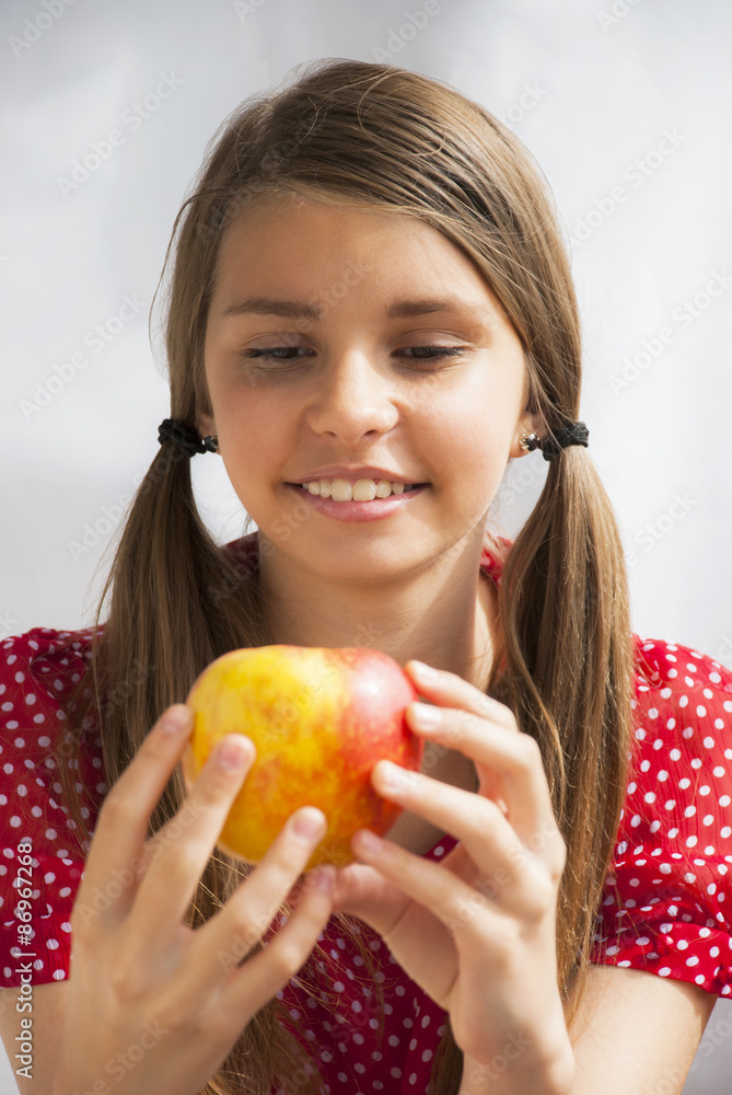 Portrait of beautiful teenage girl with apple Portrait of beautiful teenage girl with apple