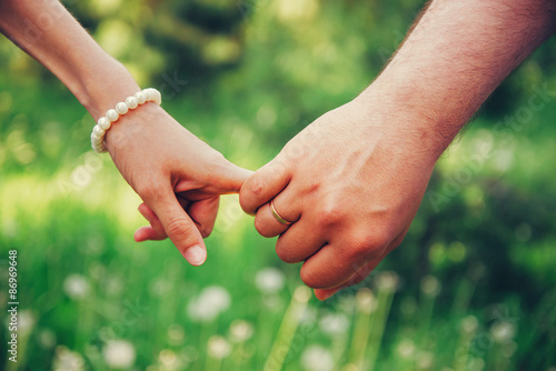 Hands of loving couple © Alex Photo