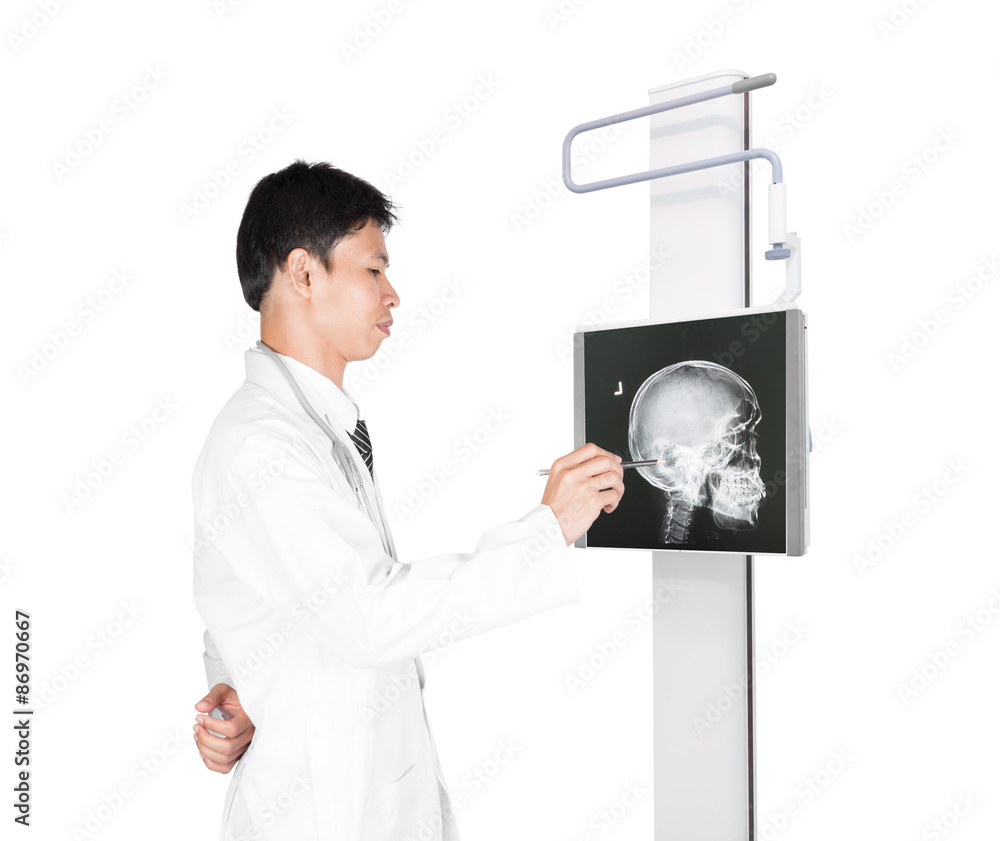 Doctors examining skull x-ray, isolated on white background Doctors examining skull x-ray, isolated on white background