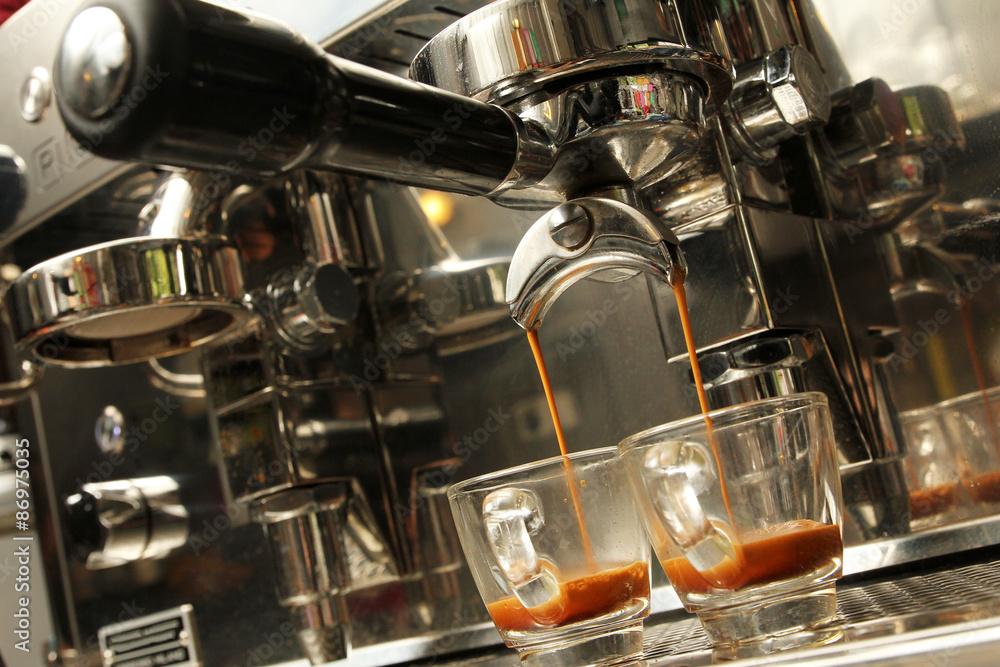 Espresso being prepared from coffee machine Espresso being prepared from coffee machine