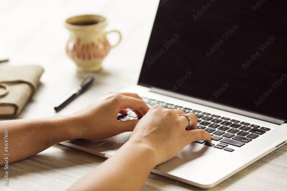 woman using laptop and on her table woman using laptop and on her table