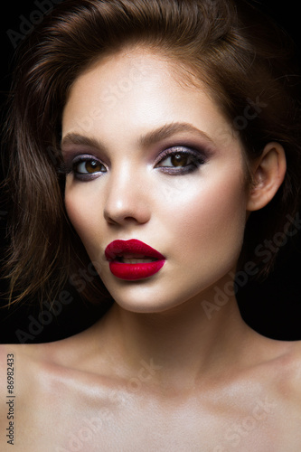 Fotografie Beautiful young model with red lips