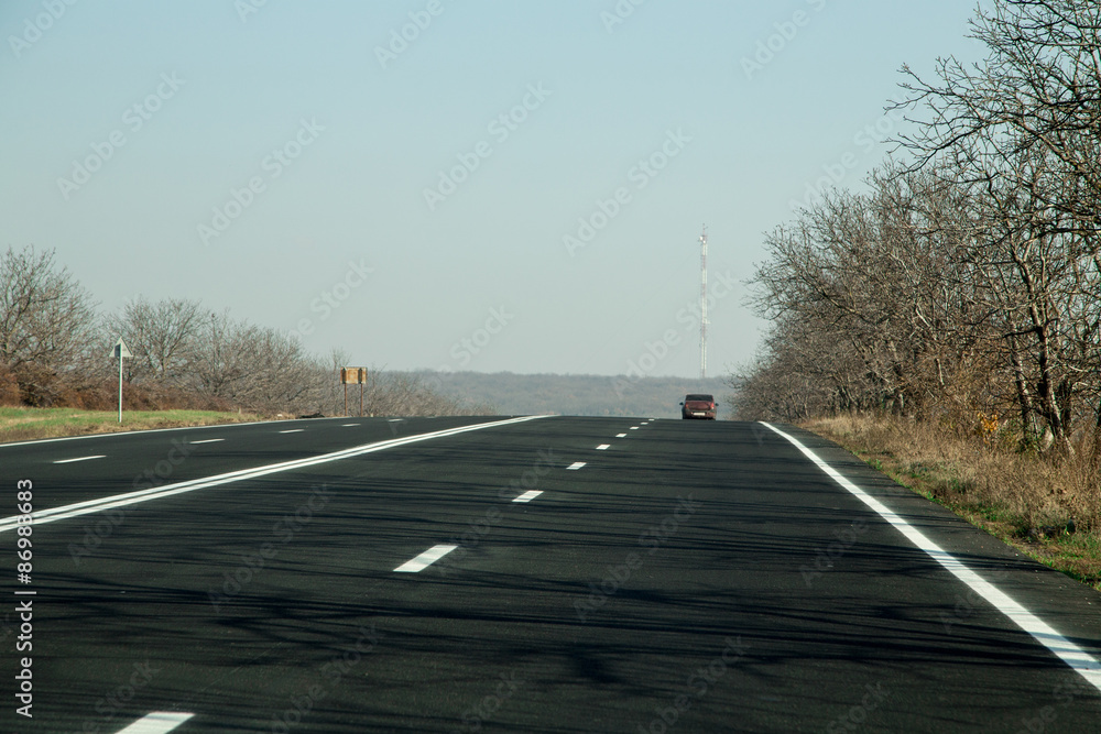 Fototapeta premium Country road on a autumn day.