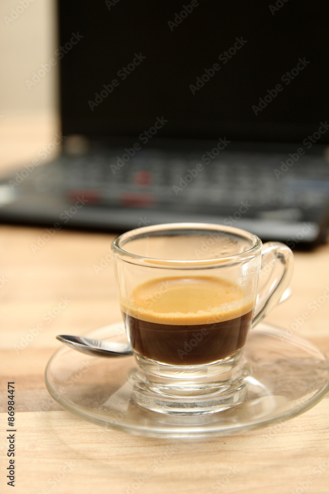 Cup of espresso coffee with laptop Cup of espresso coffee with laptop