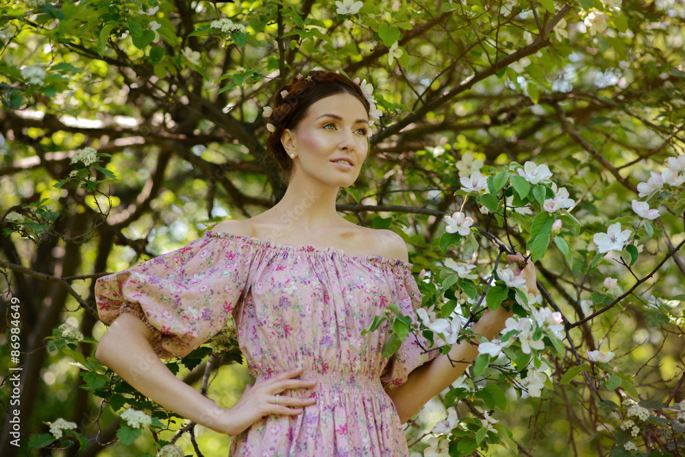 Young beautiful woman in the garden Young beautiful woman in the garden