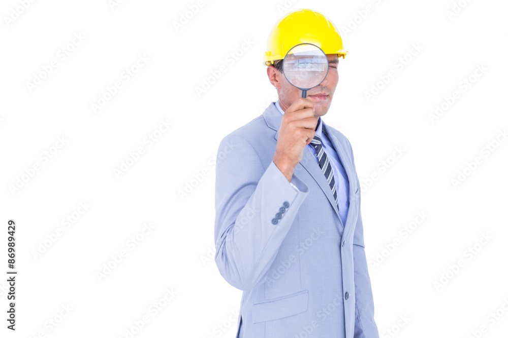 businessman with helmet and magnifier businessman with helmet and magnifier