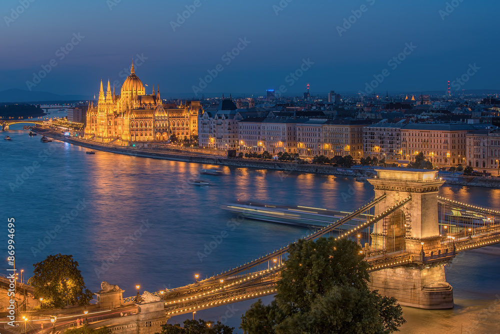 Aerial night view of Budapest, capital city of Hungary. The Szechenyi Chain Bridge. The Hungarian Parliament Building