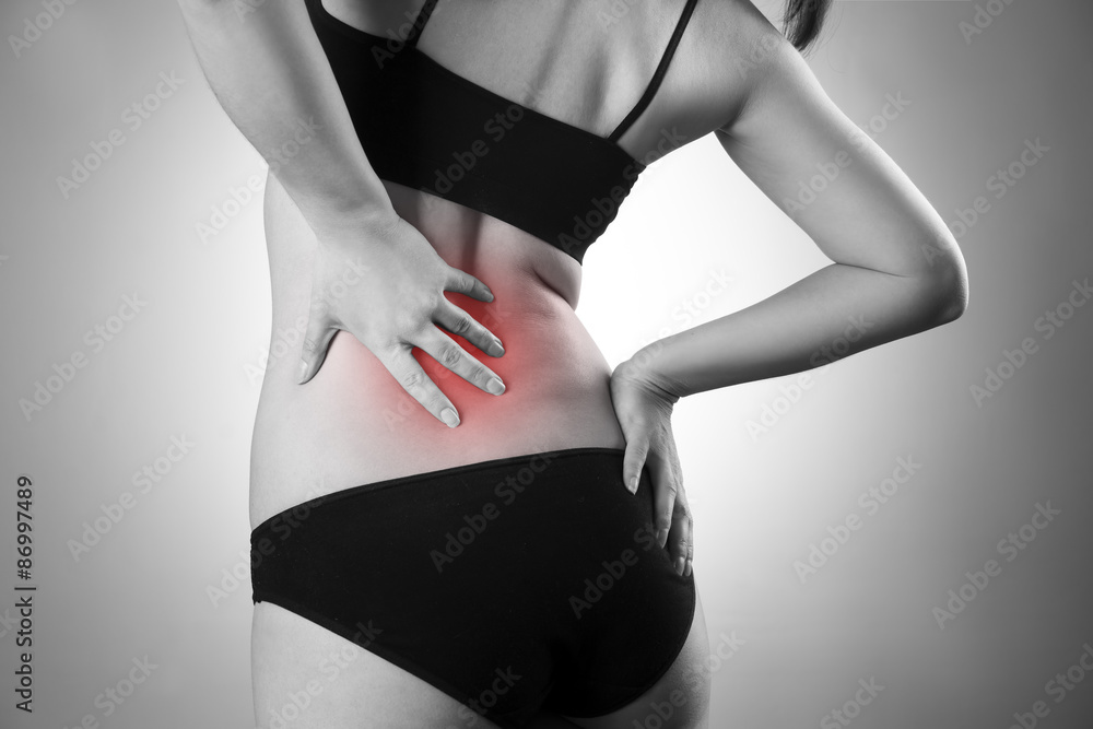 Fototapeta premium Woman with backache. Pain in the human body