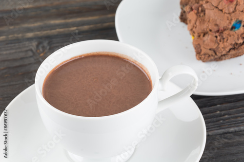 a cup of chocolate with brownie