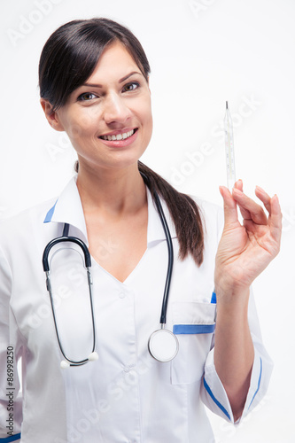 Happy doctor holding clinical thermometer photo