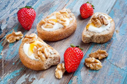 Wallpaper Mural Greek barley rusks topped with Greek yogurt, honey and walnuts and served with some fresh strawberries. Torontodigital.ca
