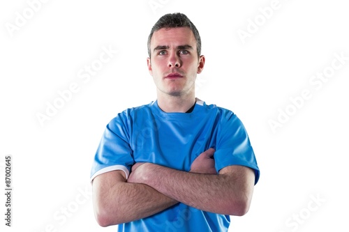 Serious rugby player with arms crossed