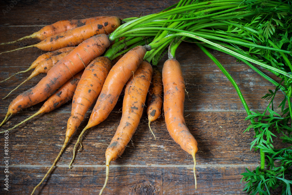 Fresh Organic Carrots on wooden background. Fresh Organic Carrots on wooden background.