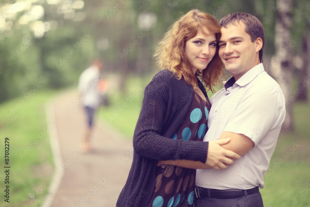 Young couple hugging in the park summer Young couple hugging in the park summer