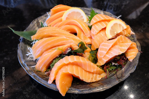 Jumbo salmon sashimi in clear bowl