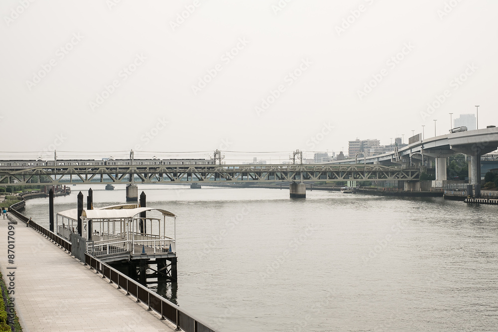 The train across a river in japan, sepia tone effect