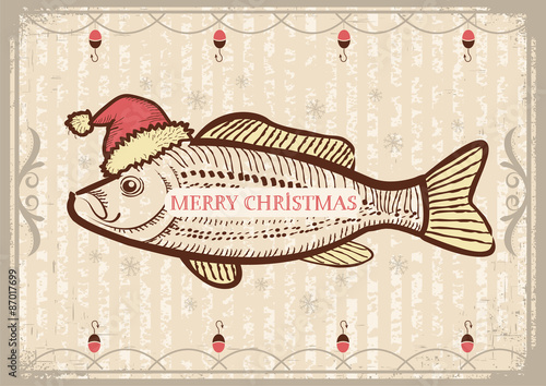 Christmas fish in Santa red hat.Vintage drawing card on old text