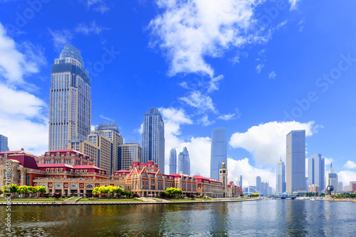 modern buildings in urban city at riverbank