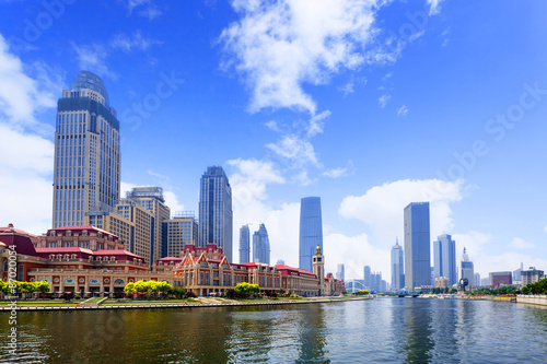 modern buildings in urban city at riverbank