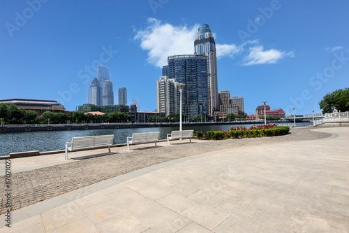 Modern skyline and empty road floor