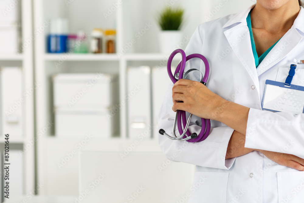 Beautiful smiling female doctor holding stethoscope Beautiful smiling female doctor holding stethoscope