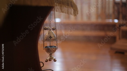 Smoldering incense in Christian church photo