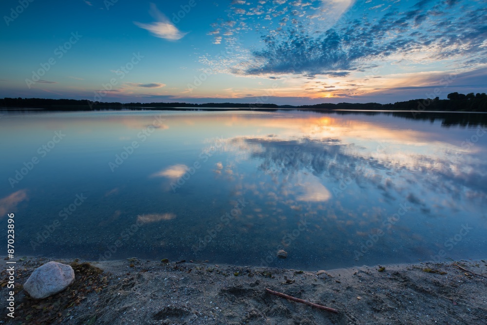 Beautiful summer sunset over lake in Poland Beautiful summer sunset over lake in Poland