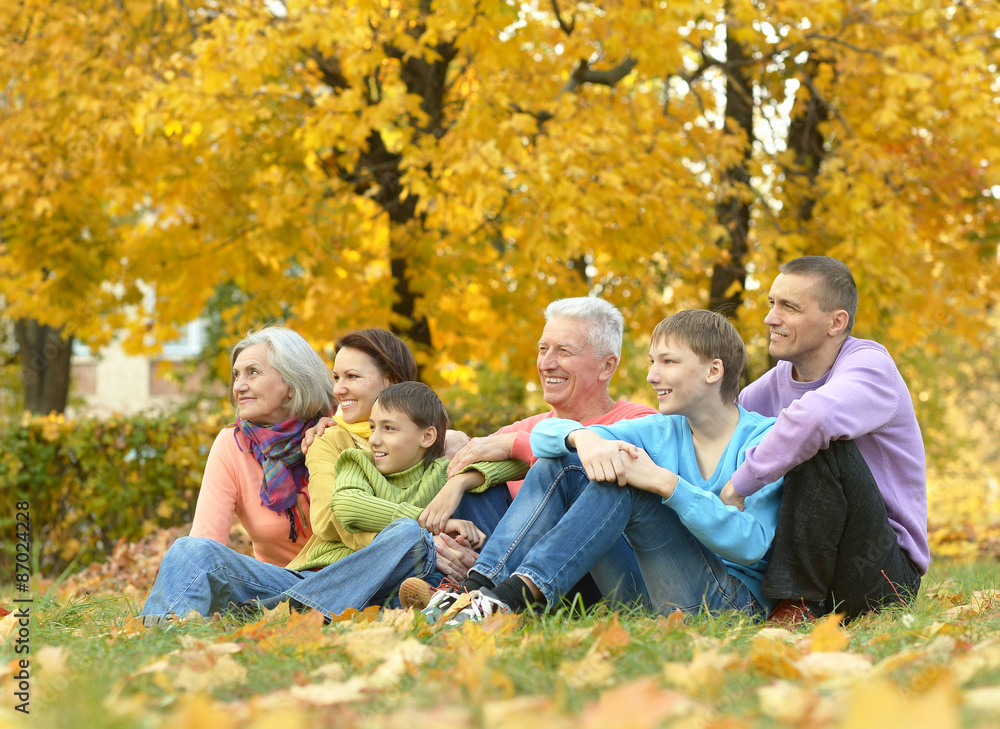 happy family relaxing in autumn forest happy family relaxing in autumn forest
