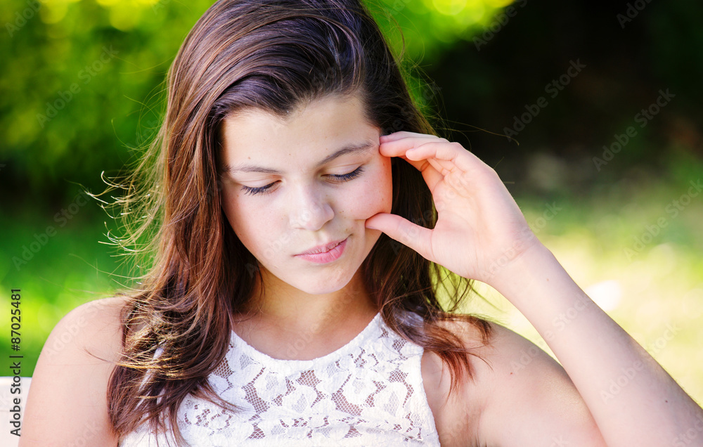 pretty girl looking sad . Closeup portrait beautiful kid with long hair. pretty girl looking sad . Closeup portrait beautiful kid with long hair.