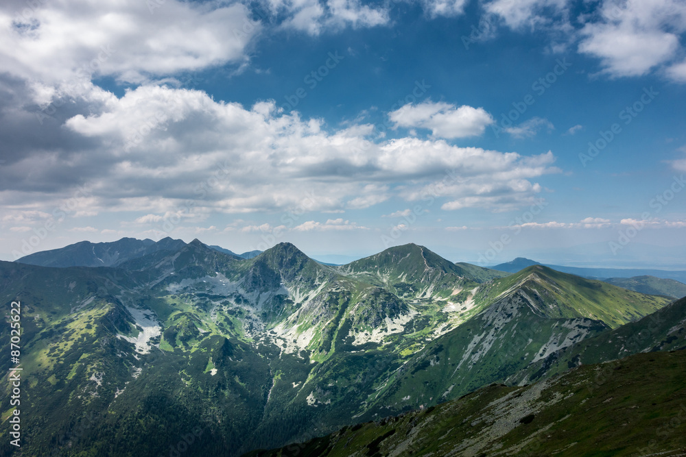 Amazing summer mountains under blue sky with clouds