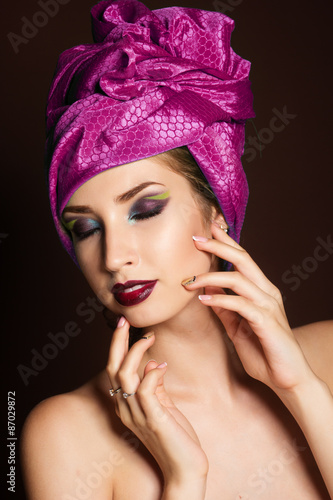 Beautiful girl with fashion purple turban on her head