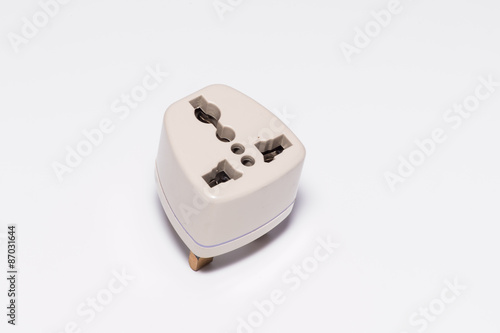 the three pin plug on paper background