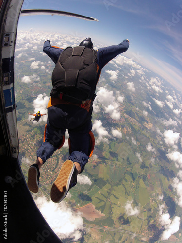 Skydiving student exit from the plane photo