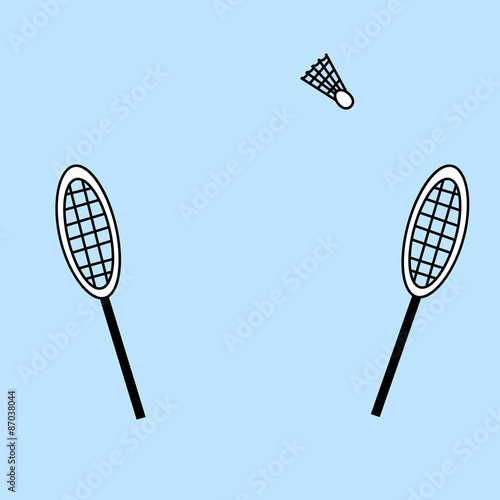 two badminton rackets and a shuttlecock