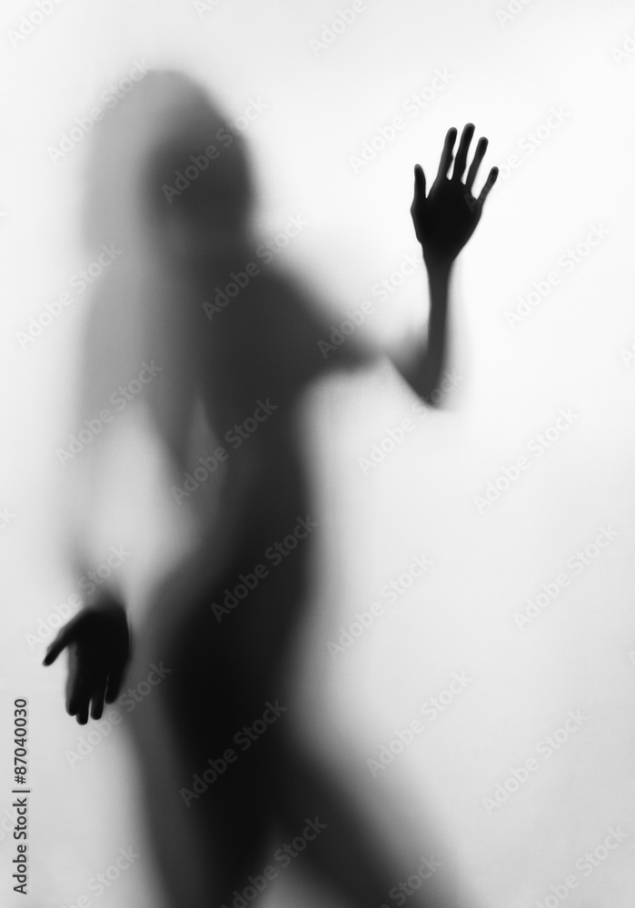 Silhouette of young sexy woman