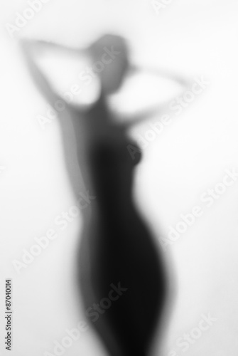 Silhouette of young sexy woman