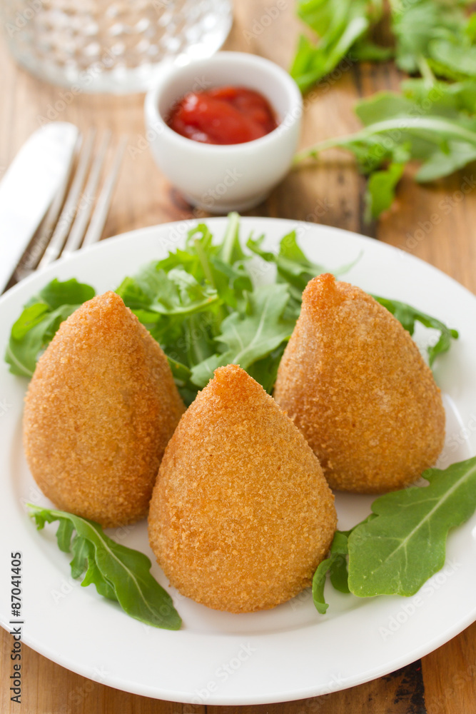 appetizer on white plate on brown background appetizer on white plate on brown background