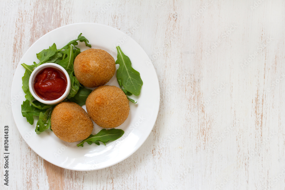 meat croquette on white plate on white background