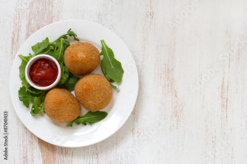 meat croquette on white plate on white background