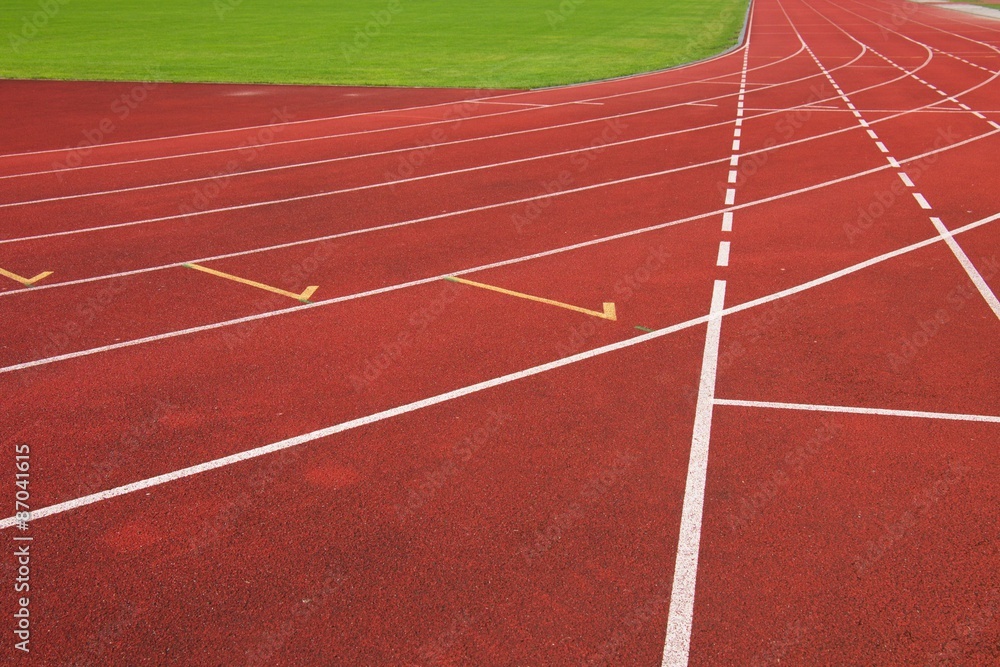 Red running racetrack on the athletic stadium Red running racetrack on the athletic stadium