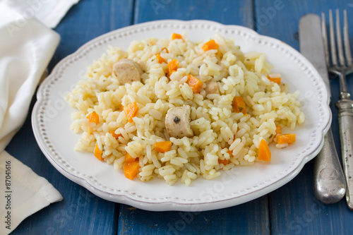 rice with meat and carrot on white plate