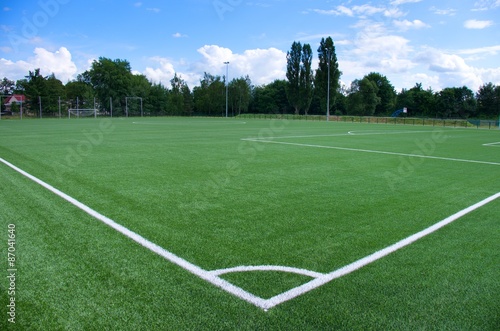 White line corner on green football field
