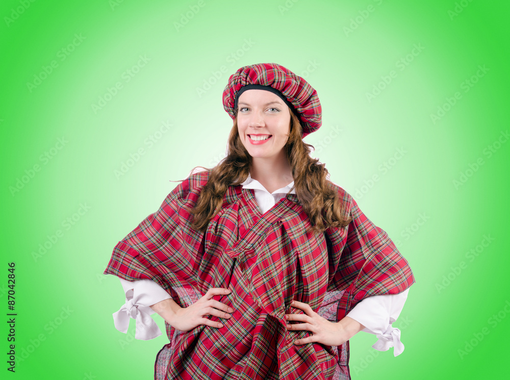 Young woman in traditional scottish clothing Young woman in traditional scottish clothing