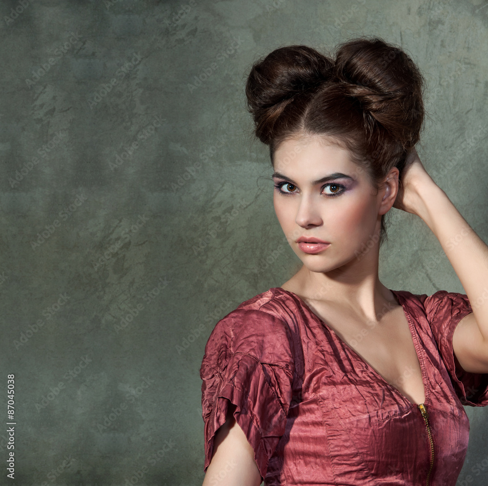 Attractive young lady in pink dress and funny styling posing on Attractive young lady in pink dress and funny styling posing on